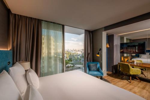 a hotel room with a bed and a large window at Barceló Anfa Casablanca in Casablanca