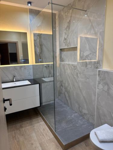 a bathroom with a shower and a sink at Excelsior Top 17 Alpenherz in Seefeld in Tirol