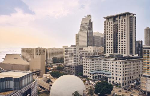 an aerial view of a city with tall buildings at The Peninsula Hong Kong in Hong Kong