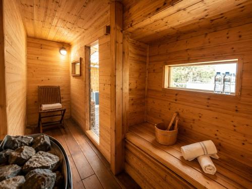 a log cabin with a sauna with a window at Spa Mari TLV in Tel Aviv