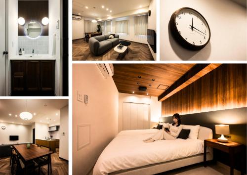 a woman sitting on a bed in a room with a clock at GIVE Meidaimae in Tokyo