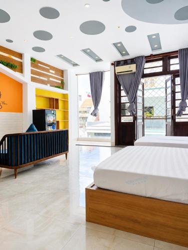 a bedroom with a bed and a tv in it at QN Home in Quy Nhon