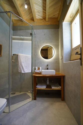a bathroom with a sink and a shower at Dera Lamsa Resort Shigar in Shigar