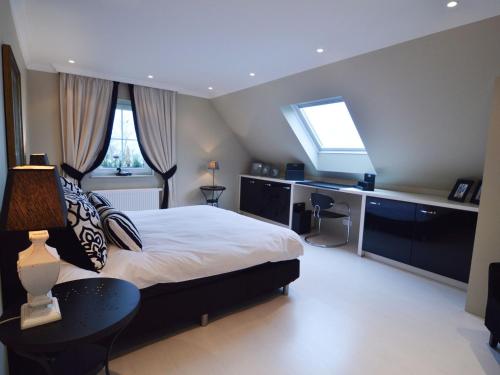 Ένα ή περισσότερα κρεβάτια σε δωμάτιο στο Forestside Retreat, Malmedy