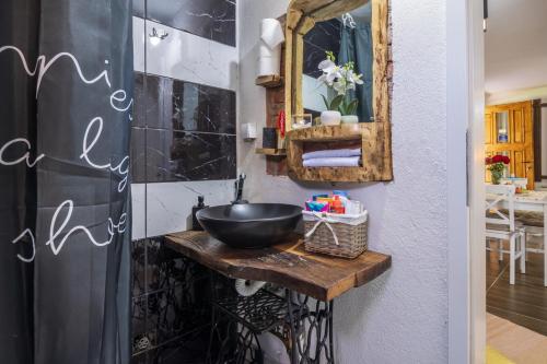 a bathroom with a sink and a mirror at Dolina Vekova in Banja