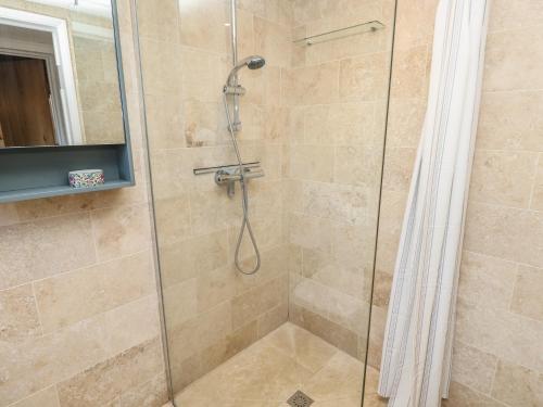 a shower with a glass shower stall in a bathroom at 5 Castle Street in Newport