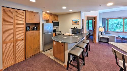 a kitchen with a large island in a room at Cahilty #149 in Sun Peaks