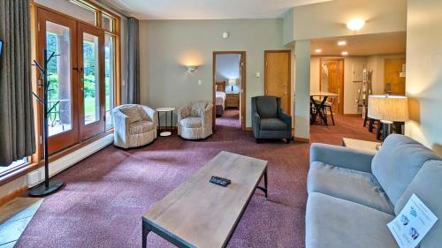 a living room with a couch and a table at Cahilty #149 in Sun Peaks