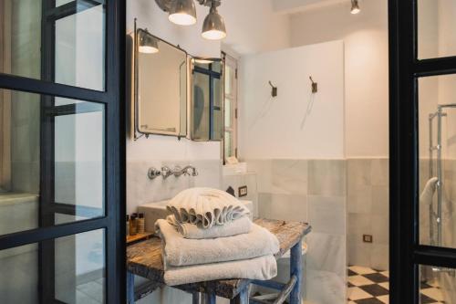 a bathroom with a sink and a mirror at Finca Hotel Rural Es Turó Spa in Ses Salines