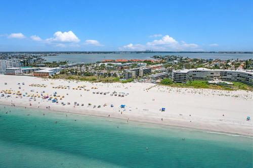 an aerial view of a beach with people on it at Gulf Strand Resort 207 in St. Pete Beach