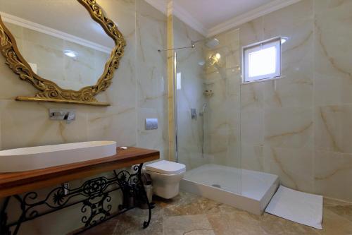 a bathroom with a shower and a sink and a toilet at Dalya Life in Göcek