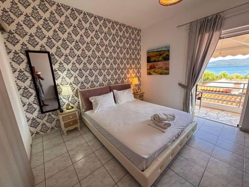a bedroom with a bed with a view of the ocean at Blu in Glida