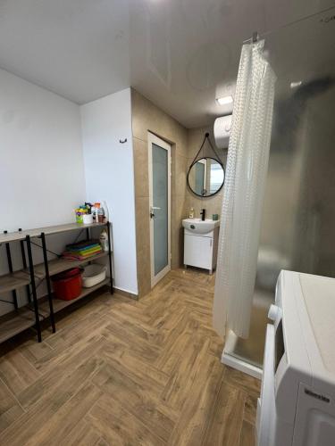 a bathroom with a sink and a toilet in a room at Апартаменти Лилия 2 in Primorsko
