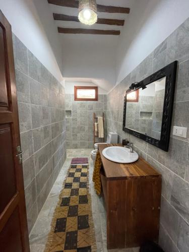 a bathroom with two sinks and a mirror at Villa Marisella in Kiwengwa