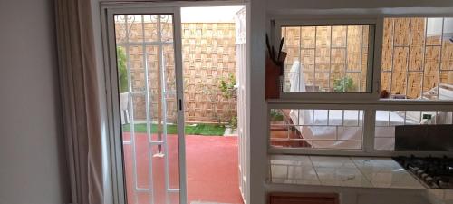 an open door with a view of a courtyard at Akari said in Rabat