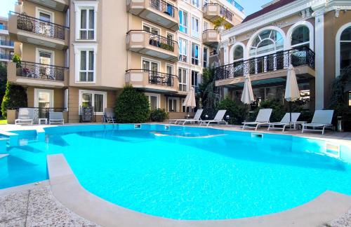 a large swimming pool in front of a building at Dawn Park Deluxe 3 floor in Sunny Beach