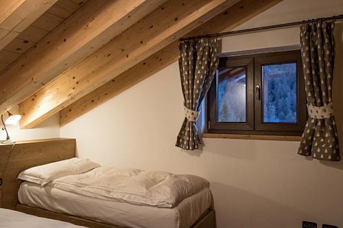 Postel nebo postele na pokoji v ubytování Residence Hotel K2