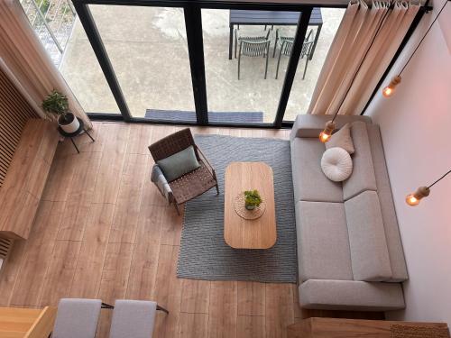 an overhead view of a living room with a couch and a table at Áčko in Oščadnica