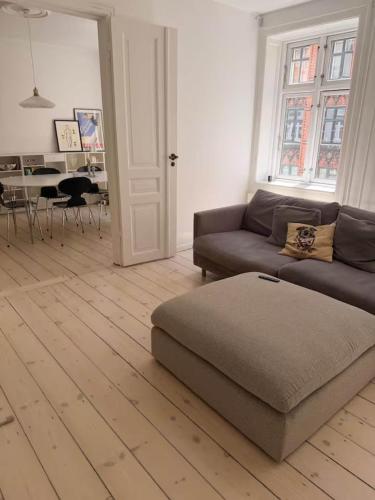 a living room with a couch and a table at Hearthstone Atelier in Antwerp