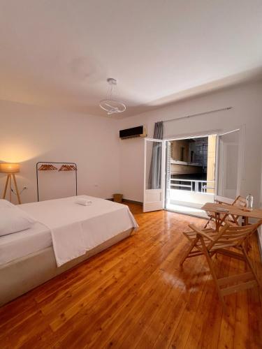 a bedroom with a bed and a desk and a table at Nile & Museum Hideaway Haraka in Cairo
