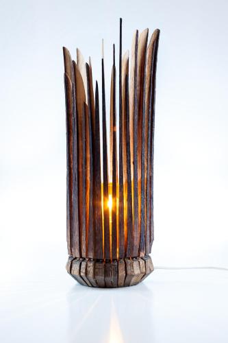 a wooden vase on a table with a light at Pension Julia & Haus Elisabeth - Wallner's Hofheuriger & Weinhof in Mörbisch am See