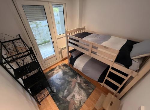 an overhead view of a bedroom with two bunk beds at Comillas 30 Primera Línea de Playa in Comillas
