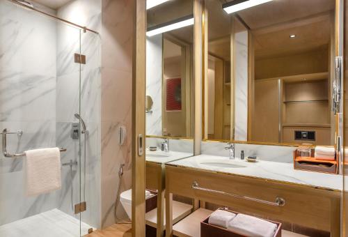 a bathroom with a sink and a shower at Aloft by Marriott Kathmandu Thamel in Kathmandu