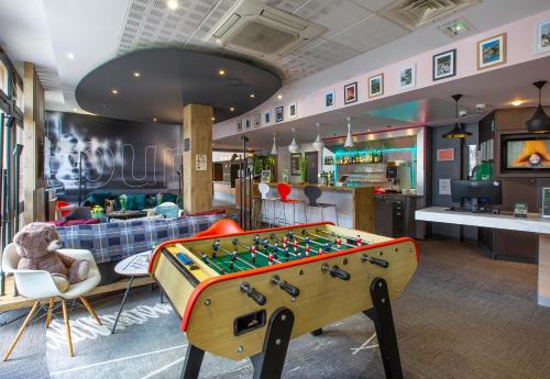 a store with a foosball table in the middle of a room at B&B HOTEL Chartres Centre Cathédrale 3 étoiles in Chartres