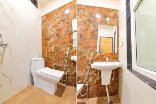a bathroom with a toilet and a sink at FabHotel The Fort - Near Amber Palace in Jaipur