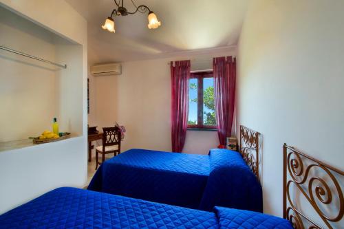 Postel nebo postele na pokoji v ubytování Agriturismo Fattoria Terranova