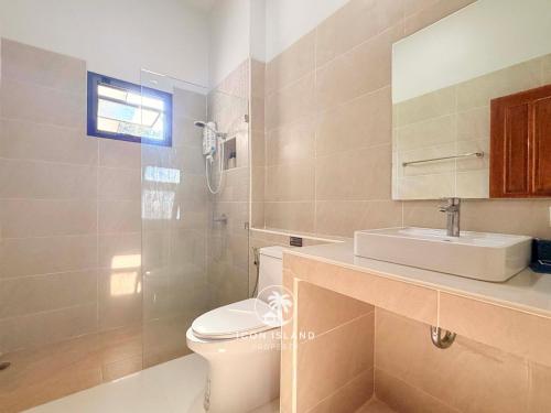 a bathroom with a toilet and a sink and a shower at Villa La Forest Koh Phangan in Ko Phangan