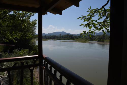 a view of a river from a balcony at Holiday Home Kućica Na Drvetu in Banja Koviljača