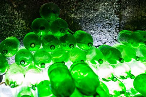 a group of green glass beads on a table at Pension Julia & Haus Elisabeth - Wallner's Hofheuriger & Weinhof in Mörbisch am See