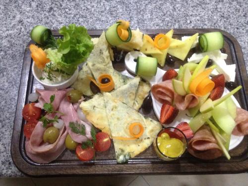 a tray of food with different types of food on it at Hotel Austria in Tirana