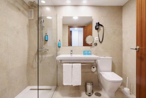 a bathroom with a toilet and a sink and a shower at AluaSun Doblemar in La Manga del Mar Menor