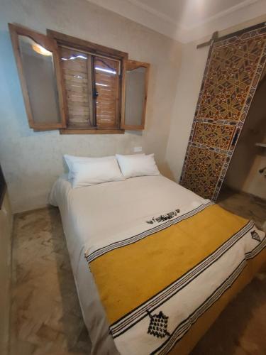 a bedroom with a large bed in a room at Dar Imran in Tangier