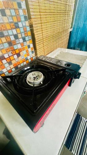 an old stove sitting on top of a table at RABIA Homestay in Tawau