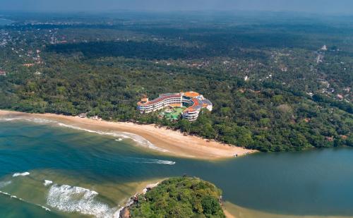 an aerial view of a building on a beach at The Eden Beruwala in Bentota