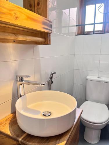 a bathroom with a sink and a toilet at Marini Ndoto in Themi