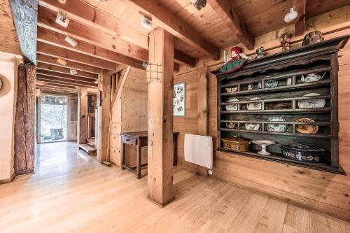 a kitchen with wooden walls and a wooden floor at Chalet Familial Chaleureux in Abondance
