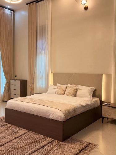 a bedroom with a large bed in a room at The Serene Sanctuary in Kampala