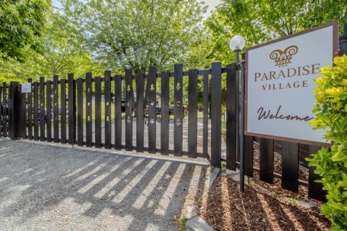 a sign for a parkridge village welcome sign at Paradise Glamping in Saint Vincent
