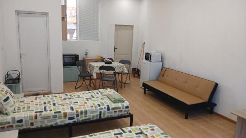 a living room with a couch and a table at Studio Miguel in Veliko Tŭrnovo