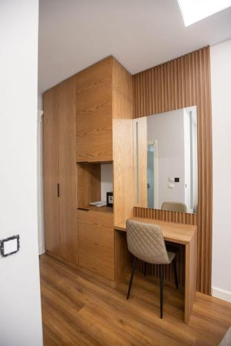 a dining room with a table and a chair at Voko by Uka Boutique Hotel in Tirana