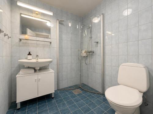 a bathroom with a toilet and a sink and a shower at Central Apartment in Geilo in Geilo