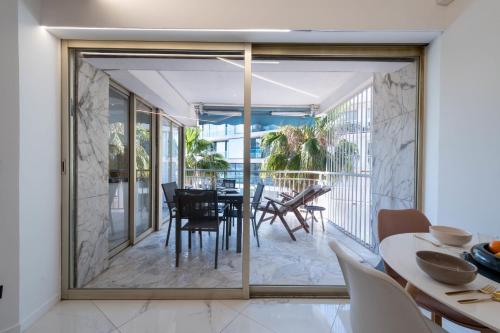 1-Bd Apartment with Terrace - Mere Steps from the Beach