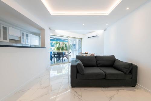 1-Bd Apartment with Terrace - Mere Steps from the Beach