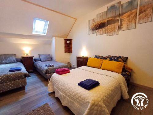 a bedroom with a bed and a couch in it at L'Escapade de JOS , chambres et table d'hôte in Pont-de-Salars