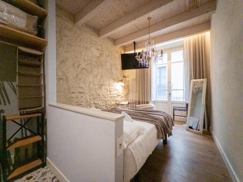 a bedroom with a bed in a room at Cielo Cagliari For2 Design - Comfort Solo Adulti in Cagliari