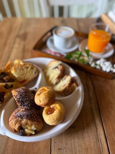 a plate of pastries on a wooden table at B&B Casa CamiLory in San Lucido